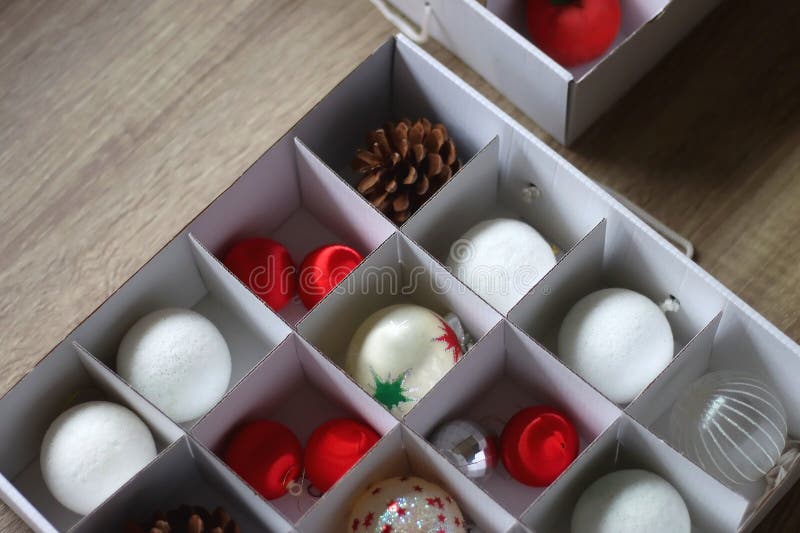 Boxes with various organized Christmas ornaments. Decorating or taking down the Christmas tree. Selective focus. Boxes with various organized Christmas ornaments. Decorating or taking down the Christmas tree. Selective focus.