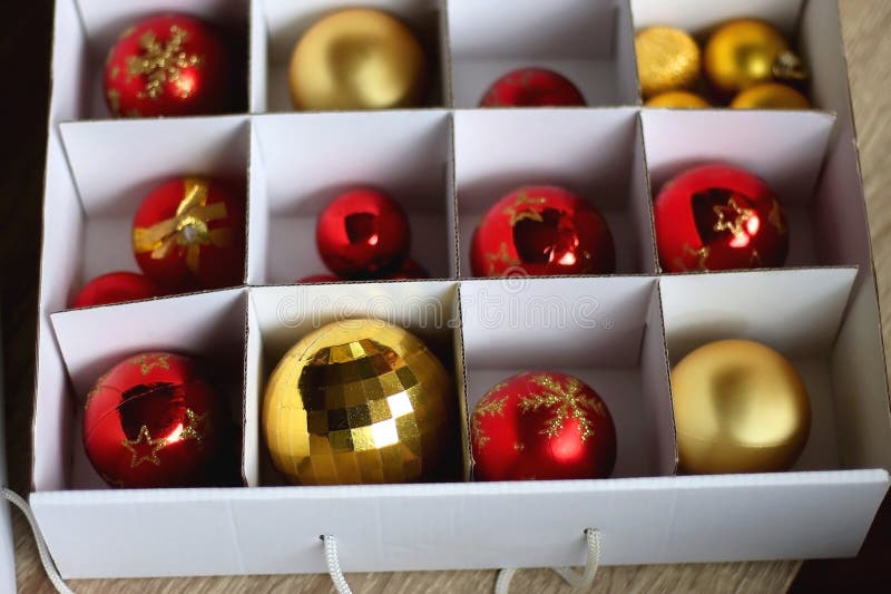 Boxes with various organized Christmas ornaments. Decorating or taking down the Christmas tree. Selective focus. Boxes with various organized Christmas ornaments. Decorating or taking down the Christmas tree. Selective focus.