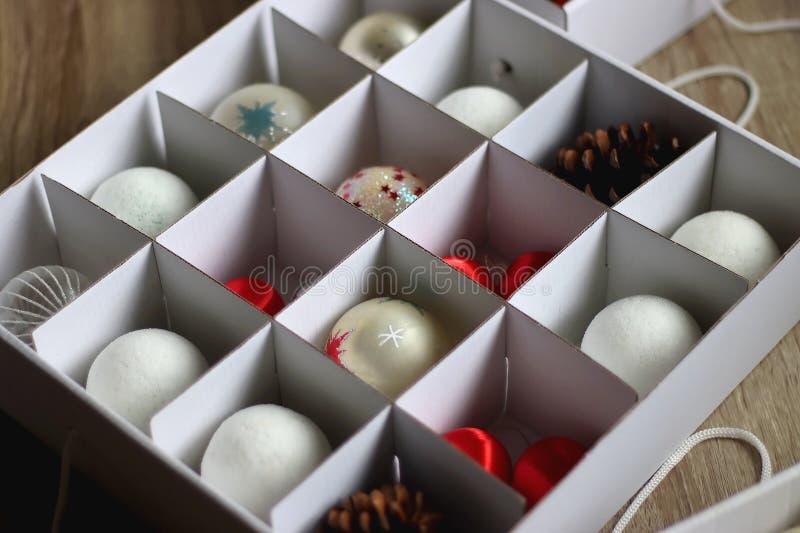 Boxes with various organized Christmas ornaments. Decorating or taking down the Christmas tree. Selective focus. Boxes with various organized Christmas ornaments. Decorating or taking down the Christmas tree. Selective focus.