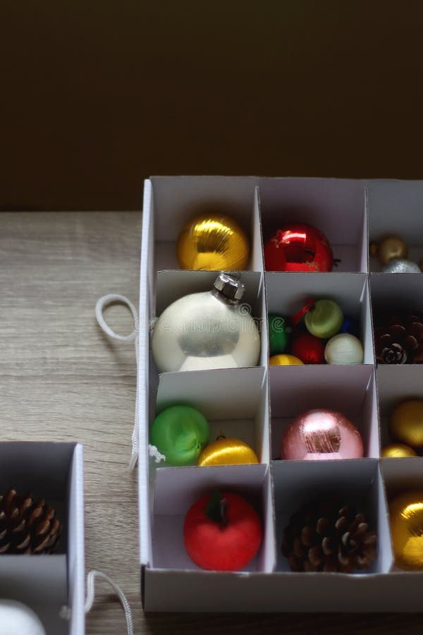 Boxes with various organized Christmas ornaments. Decorating or taking down the Christmas tree. Selective focus. Boxes with various organized Christmas ornaments. Decorating or taking down the Christmas tree. Selective focus.