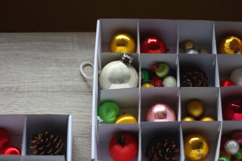 Boxes with various organized Christmas ornaments. Decorating or taking down the Christmas tree. Selective focus. Boxes with various organized Christmas ornaments. Decorating or taking down the Christmas tree. Selective focus.