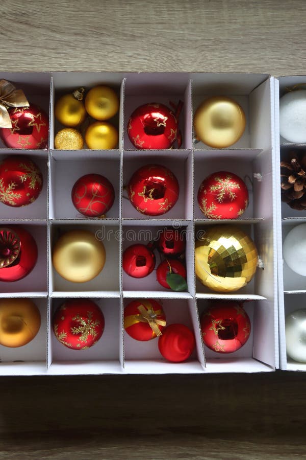 Boxes with various organized Christmas ornaments. Decorating or taking down the Christmas tree. Top view. Boxes with various organized Christmas ornaments. Decorating or taking down the Christmas tree. Top view.