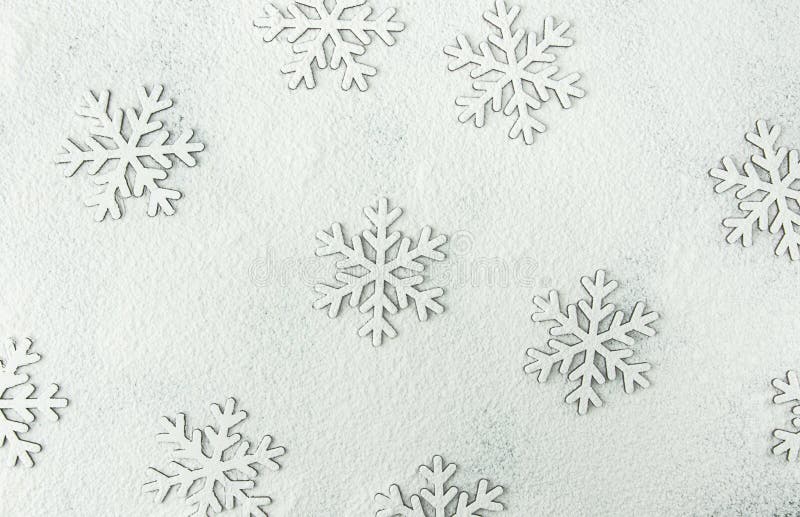 Christmas Snow Flakes Silhouette Pattern on Snowy White Background Powdered with Flour. New Year Holiday Greeting Card. Poster Template. Baking Copy Space. Creative Image. Christmas Snow Flakes Silhouette Pattern on Snowy White Background Powdered with Flour. New Year Holiday Greeting Card. Poster Template. Baking Copy Space. Creative Image