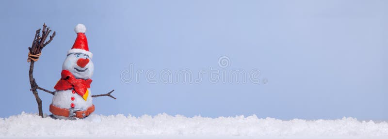 Christmas snowman in the snow is new in 2017 against the backdrop of snowflakes and illumination. Christmas snowman in the snow is new in 2017 against the backdrop of snowflakes and illumination