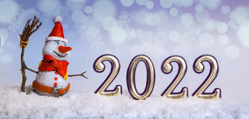 Christmas snowman in the snow is new year in 2022 against the backdrop of snowflakes and illumination. Christmas snowman in the snow is new year in 2022 against the backdrop of snowflakes and illumination.