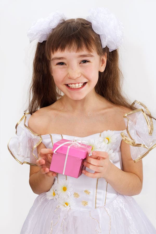 Little laughing girl with christmas present. Little laughing girl with christmas present