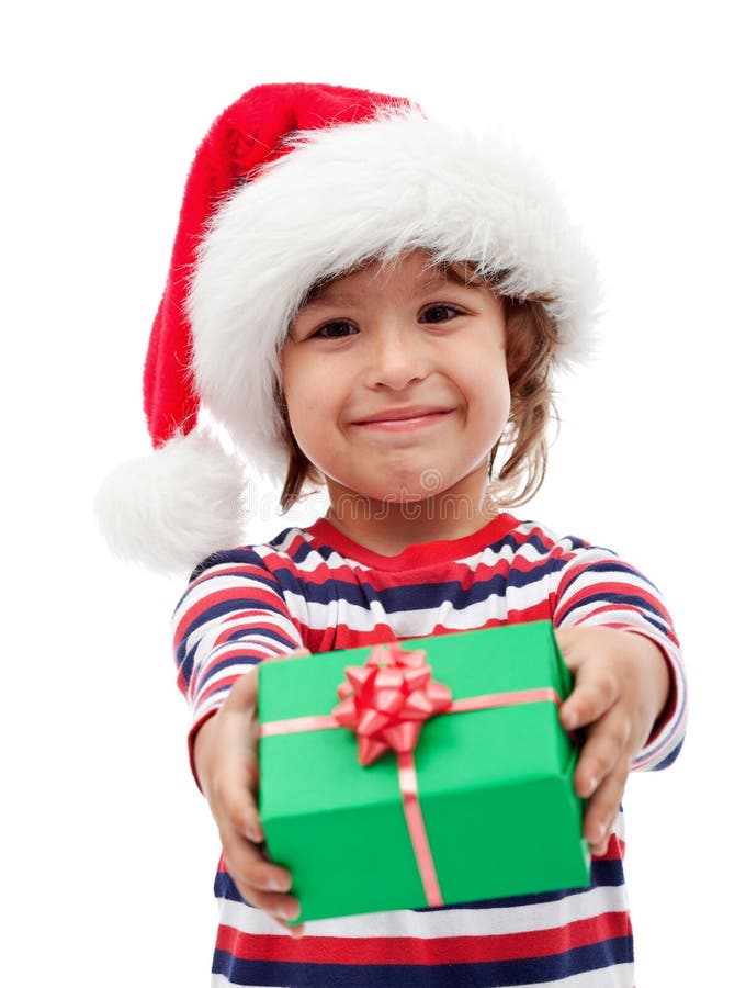 Adorable little boy offering a christmas present. Adorable little boy offering a christmas present