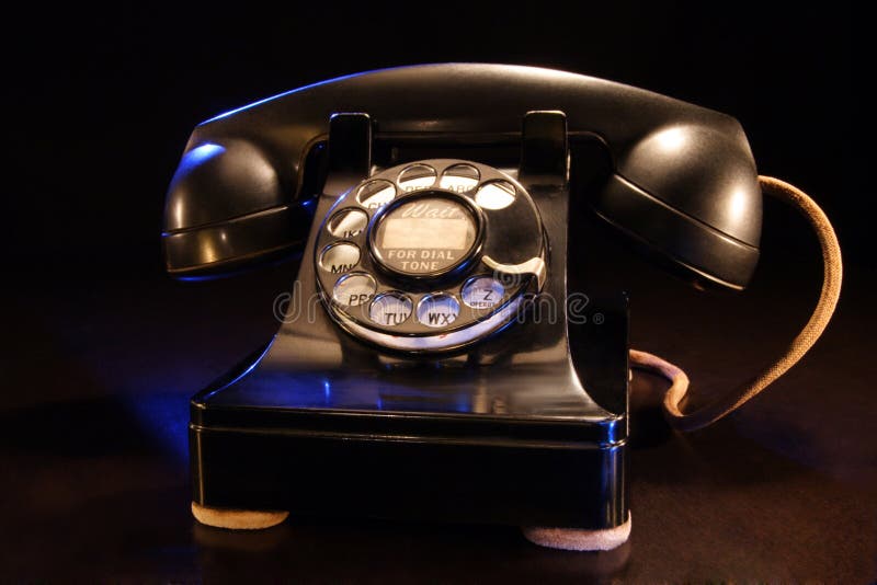 A stock photograph of a vintage black rotary telephone from the 1940's era. A stock photograph of a vintage black rotary telephone from the 1940's era.