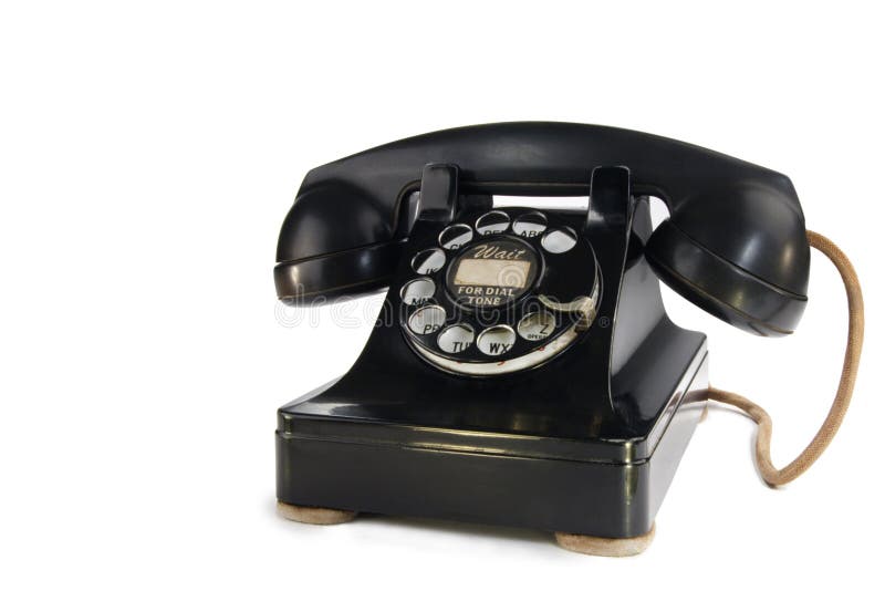 A stock image of a vintage 1940's rotary phone isolated on white. Room for text. A stock image of a vintage 1940's rotary phone isolated on white. Room for text.