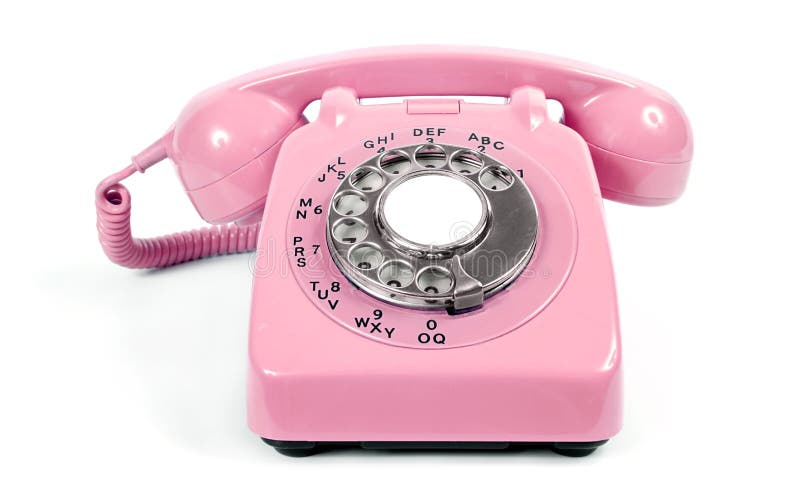 Vintage rotary dial pink telephone on white background from the 1960s. Vintage rotary dial pink telephone on white background from the 1960s