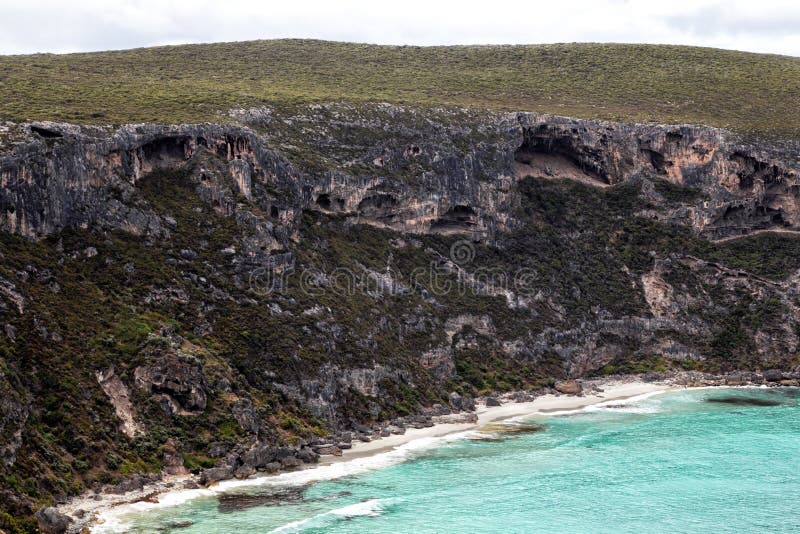 Caves at the steep coast at Weirs Cove in the Flinders Chase National Park on Kangaroo Island, South Australia, Australia. Caves at the steep coast at Weirs Cove in the Flinders Chase National Park on Kangaroo Island, South Australia, Australia.