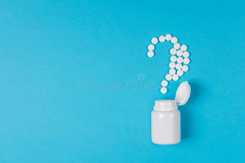 White pills in a question mark poured from a medicine bottle on blue background. Medication and prescription pills. What medicines to choose better, what will help? Top view. Flat lay. White pills in a question mark poured from a medicine bottle on blue background. Medication and prescription pills. What medicines to choose better, what will help? Top view. Flat lay.