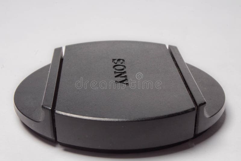 Weißer Hintergrund schwarzer Sony-Kappe lizenzfreies stockfoto Weißer Hintergrund schwarzer Sony-Kappe lizenzfreies stockfoto