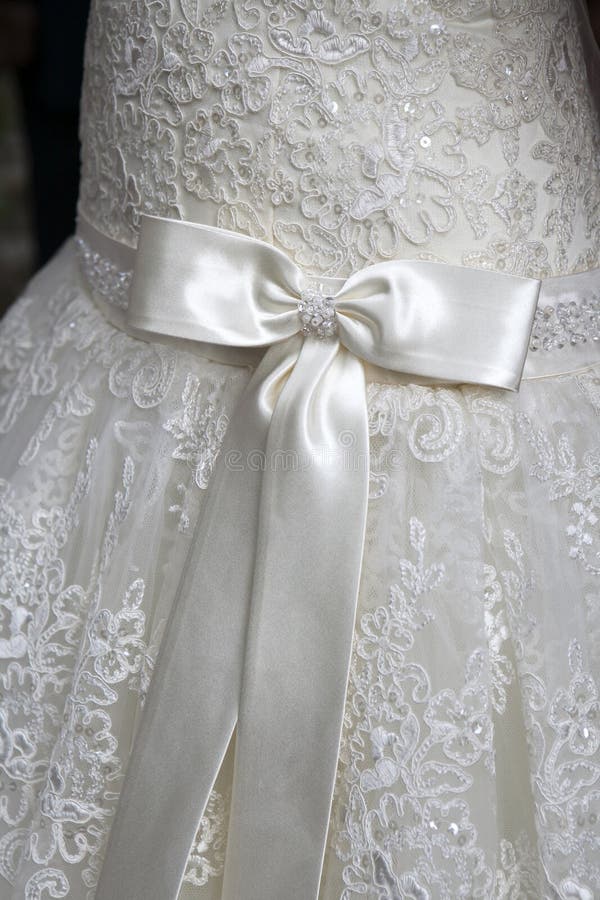 Detail from the back of a white wedding dress. Detail from the back of a white wedding dress