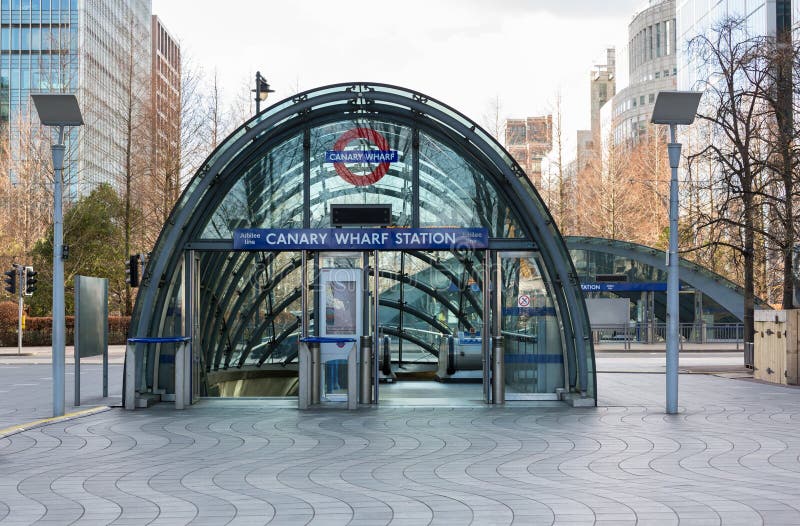 LONDON, UK - JANUARY 30, 2016: Modern entrance to Jubilee line tube station in Canary Wharf, Docklands, London, England. LONDON, UK - JANUARY 30, 2016: Modern entrance to Jubilee line tube station in Canary Wharf, Docklands, London, England