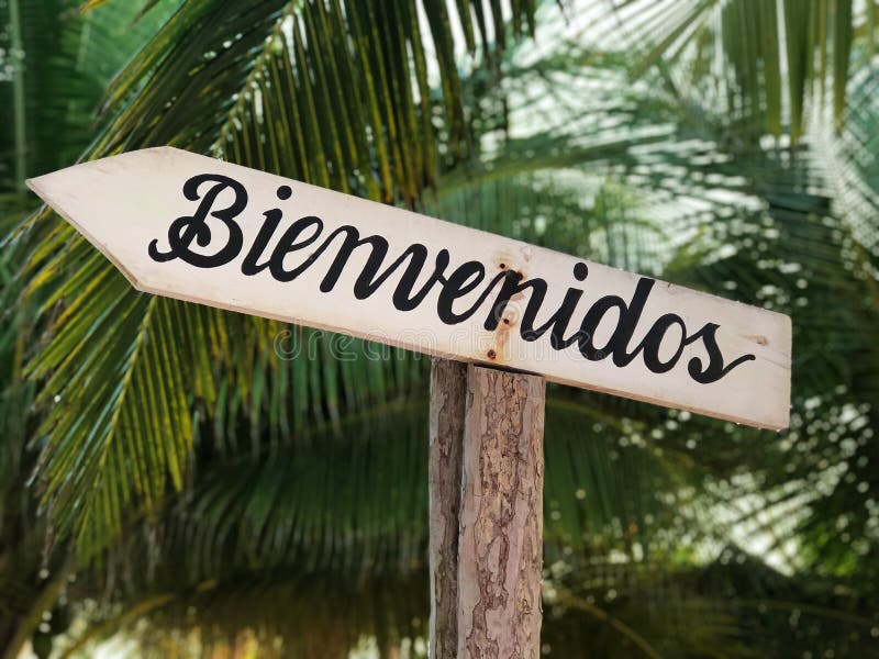 Bienvenidos! (Welcome! In Spanish) Sign With Arrow On Beach Background  Stock Photo, Picture and Royalty Free Image. Image 61777657.