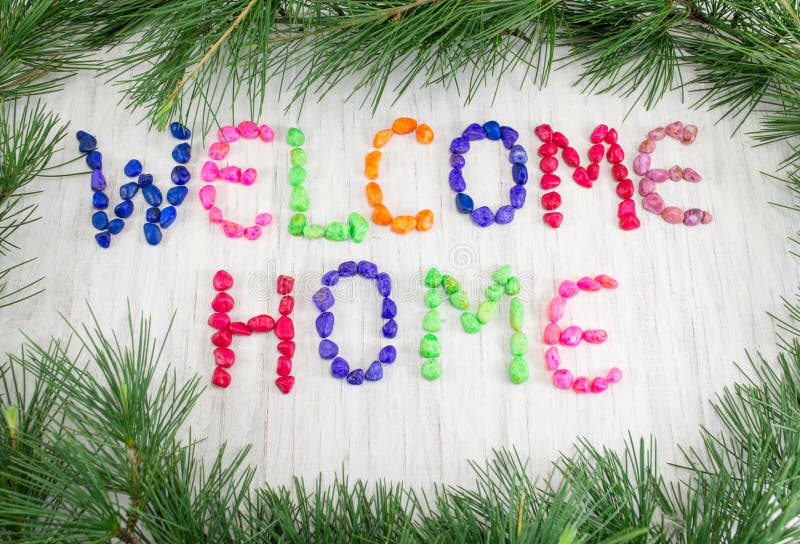 Welcome home note written with small rocks