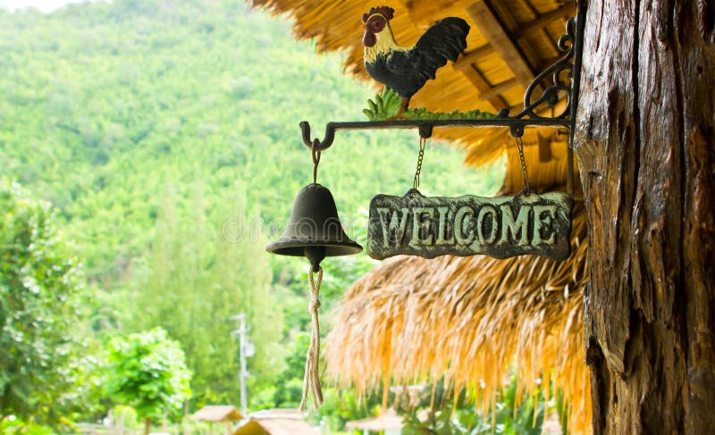 Welcome sign and bell