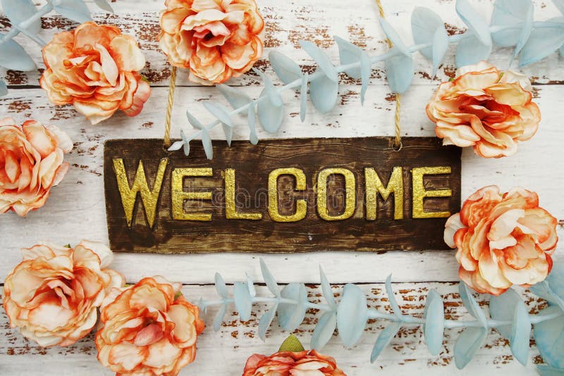 Welcome Sign with Flowers Frame Decorate on Wooden Background Stock Image -  Image of green, copy: 232554083