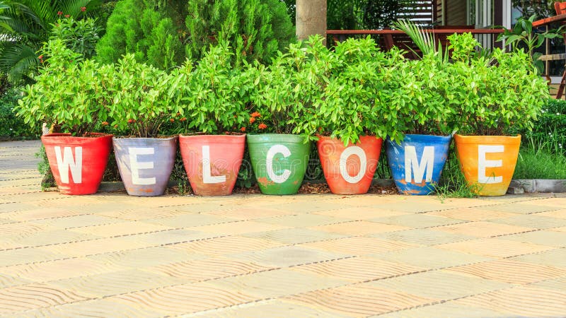 Welcome text sign on colorful pottery stock photos