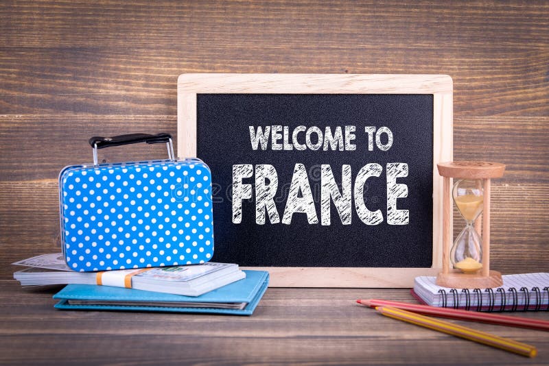Welcome to France. Chalkboard on a wooden background. business trip or holiday planning royalty free stock images Welcome to France. Chalkboard on a wooden background. business trip or holiday planning royalty free stock images
