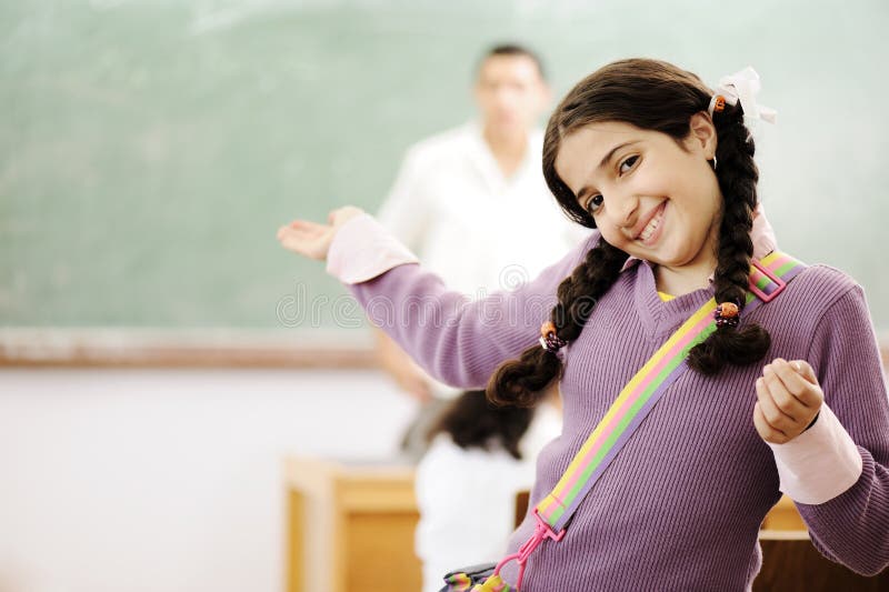 Welcome to my school: adorable schoolgirl smiling