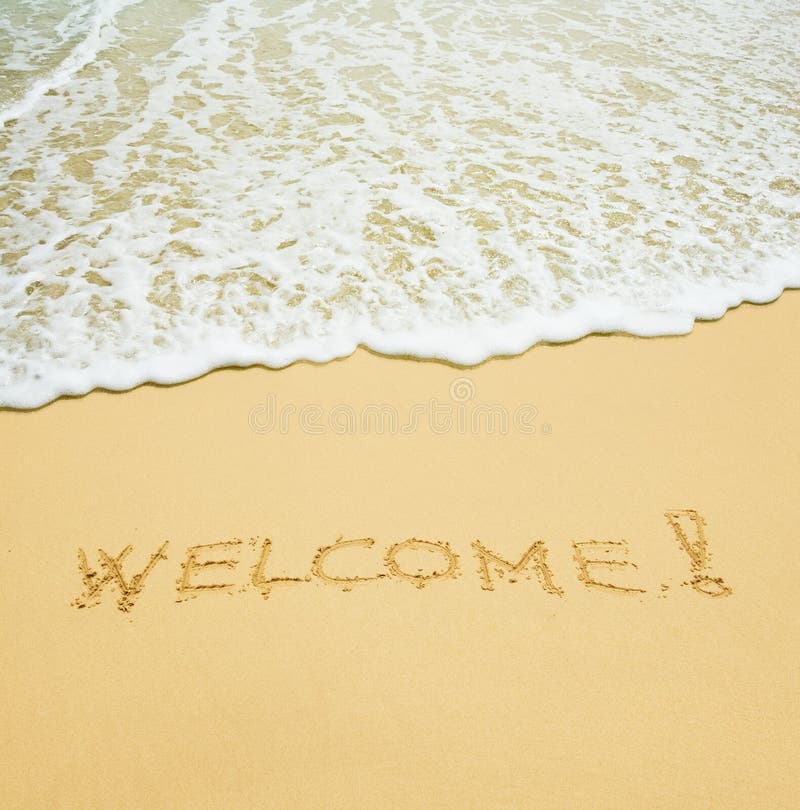 Welcome written in a sand