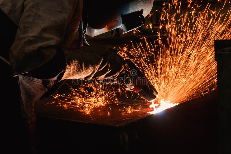 Welder arc Gouging carbon with sparks and smoke