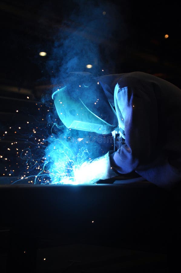 Welder Assembling Technical Steel. Industrial Welding of Metal
