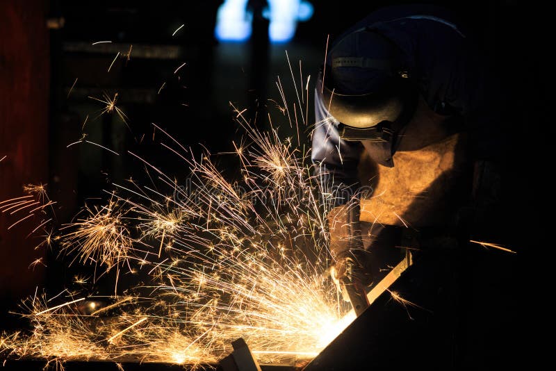 Welder is cutting steel frame by carbon air arc gouging