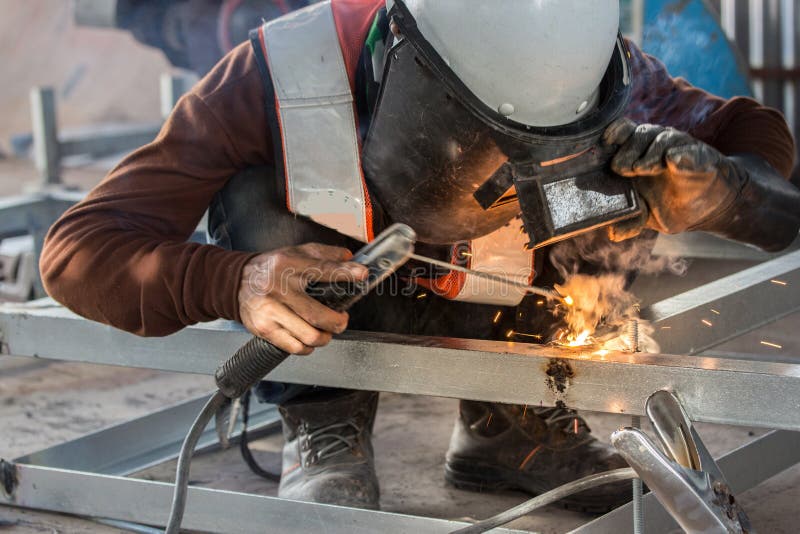 The Welder in the Operate,Employee Welding Usteel Using Welder Machine