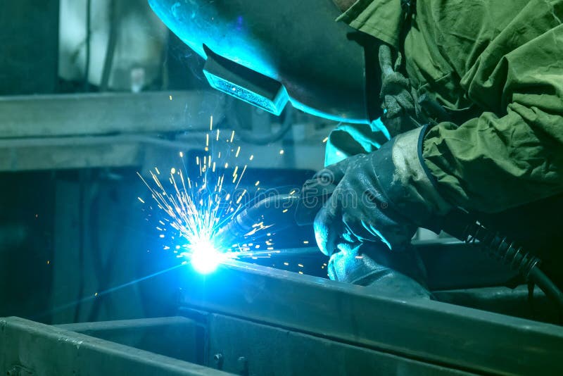 The Welder Performs Welding Work with Semiautomatic Arc Welding