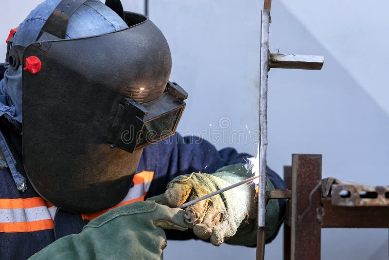 Welder Qualification. the Welder is Welding with Shielded Metal Arc