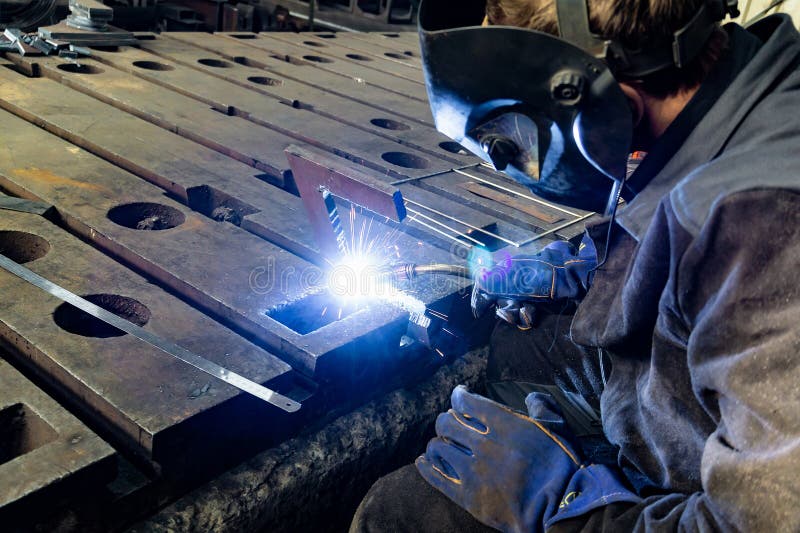 Electric Gas Welding in the Sparks from Welding Stock Photo