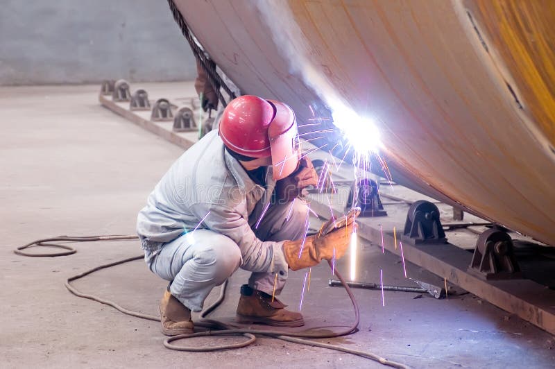 A welder is working