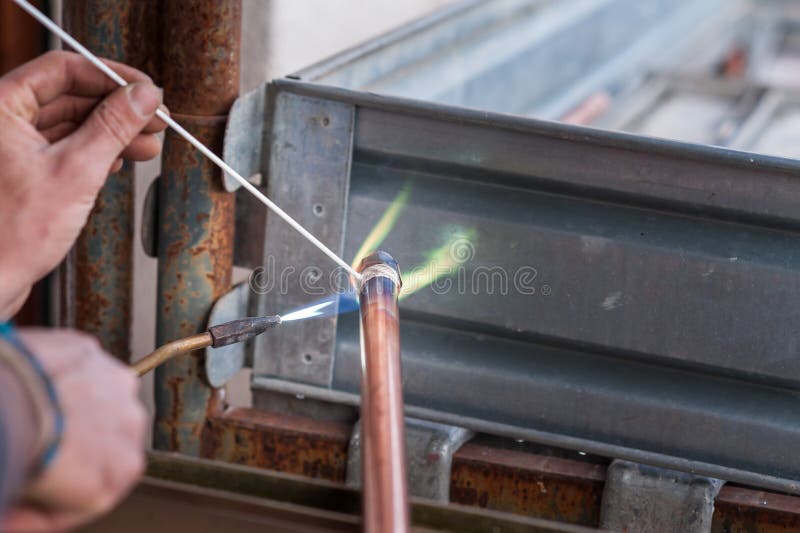 Welding of copper pipe. stock image. Image of contractor 116018443