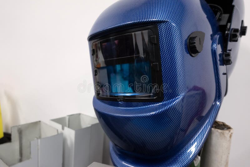 Welding Helmet Handing In On White Background. Welder