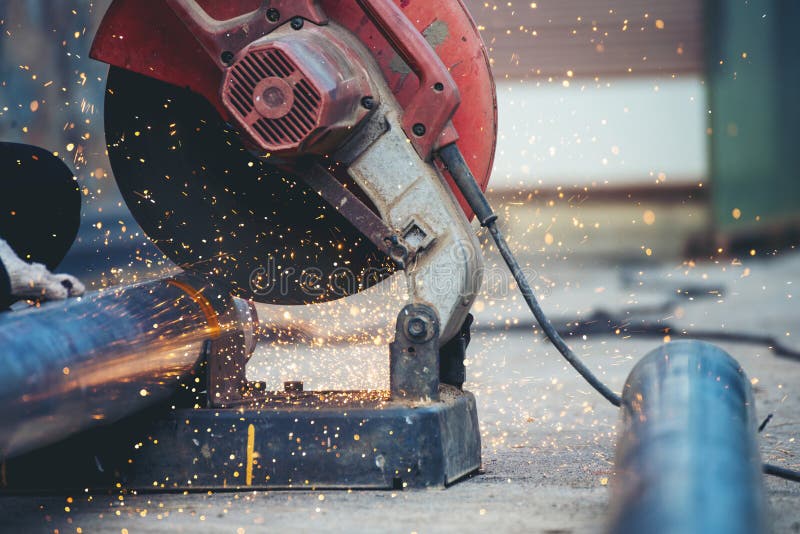 Welding machine iron metal sparking. Hot flame welding metal work cutting fire iron workshop. Locksmith using Welding machine royalty free stock photo