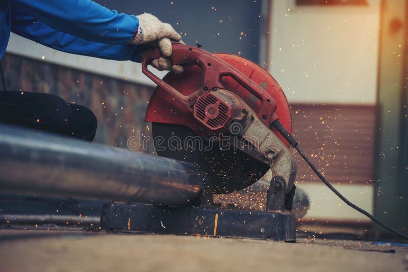 Welding machine iron metal sparking. Hot flame welding metal work cutting fire iron workshop. Locksmith using Welding machine royalty free stock photography
