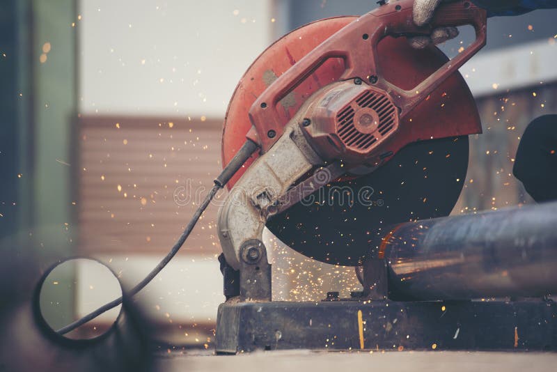 Welding machine iron metal sparking. Hot flame welding metal work cutting fire iron workshop. Locksmith using Welding machine royalty free stock photo