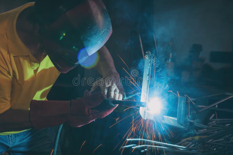 Welding steel elements at the factory or workshop royalty free stock photos Welding steel elements at the factory or workshop royalty free stock photos