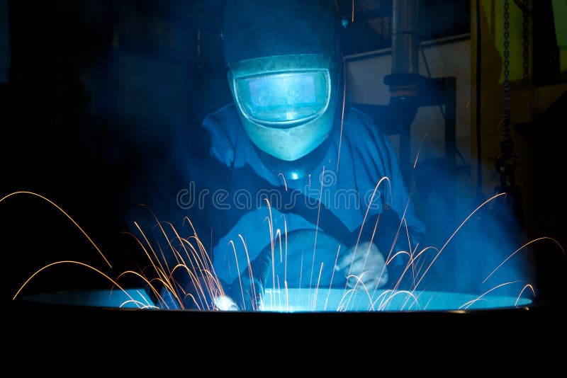 Welding a steel wheel with sparks spraying out