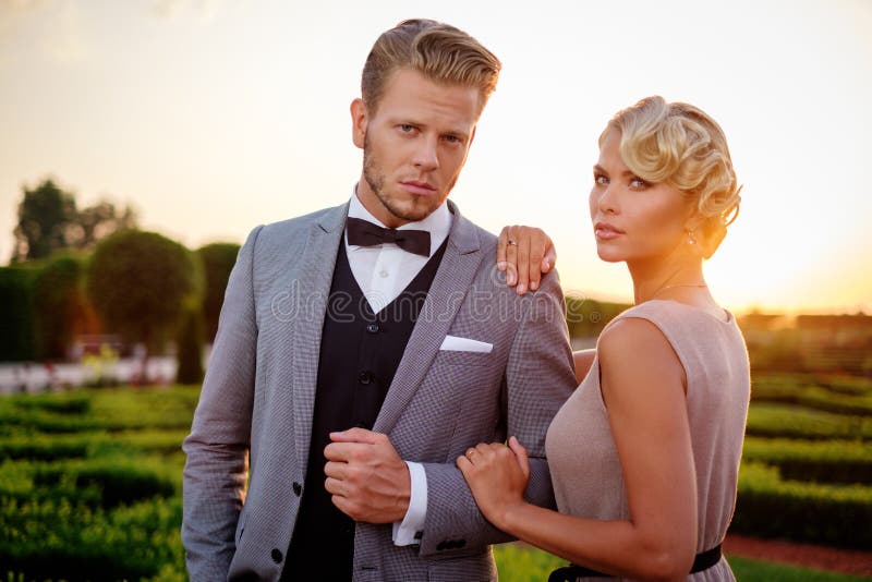Dressedup Couple Anticipating a Great Date Evening at Nice Cafe Stock