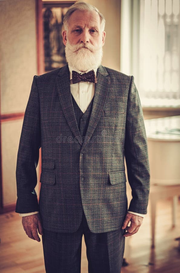 Well-dressed senior man in luxury interior