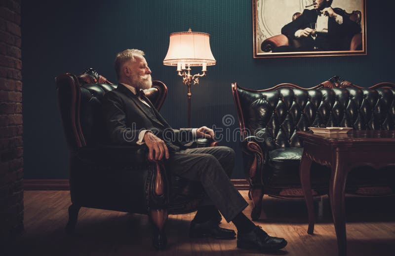 Well-dressed senior man in luxury interior