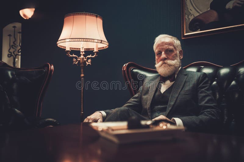 Well-dressed senior man in luxury interior