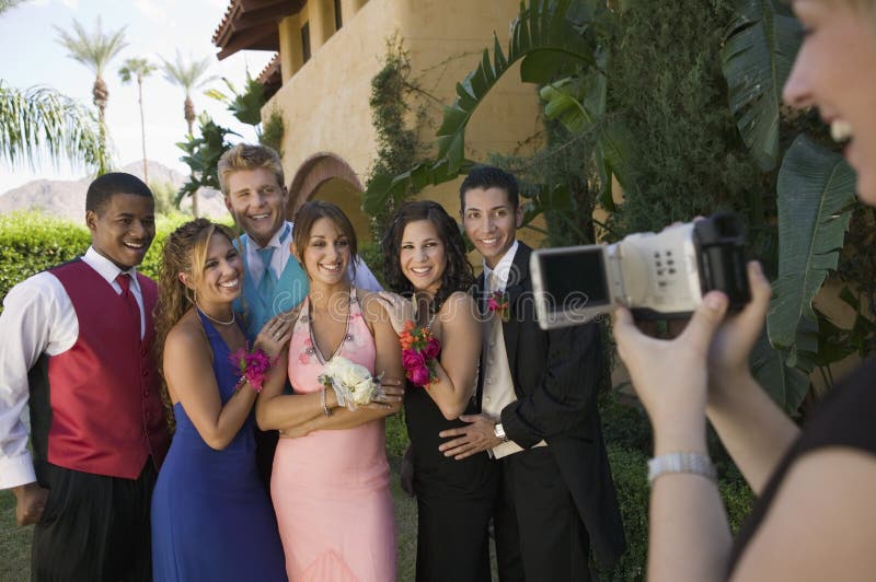 Well-dressed teenagers posing for video camera