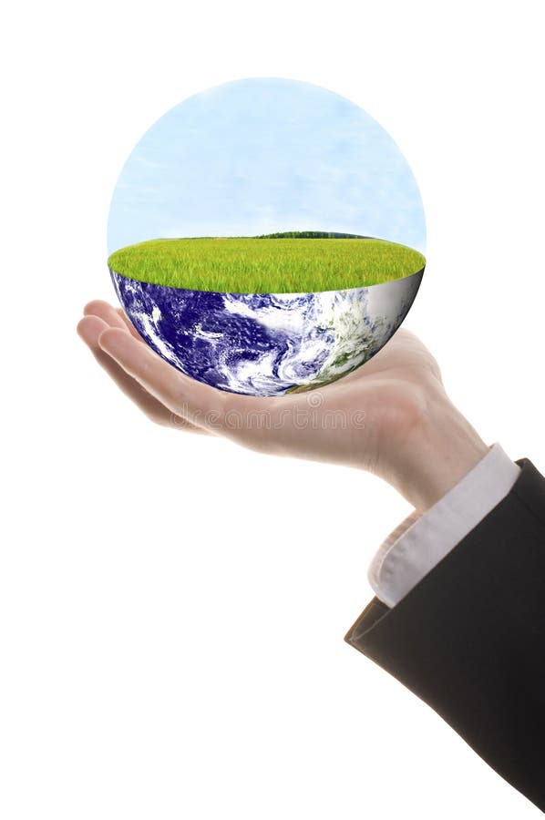 Well shaped businessman hand with green earth