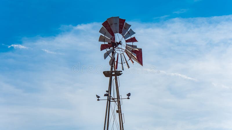 Well water pump wind mill in American southern state of Texas, hill country area