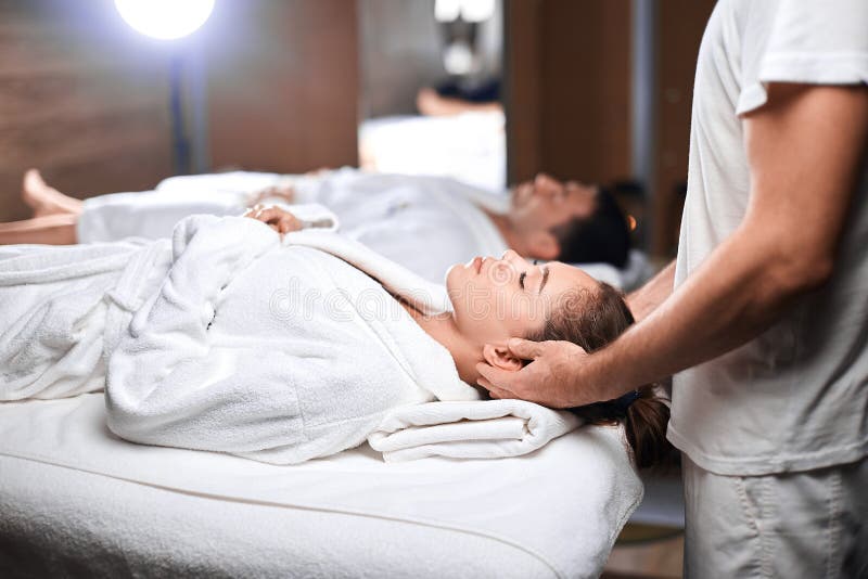 Beautiful Young Woman Receiving Massage On Head And Shoulders Zone In